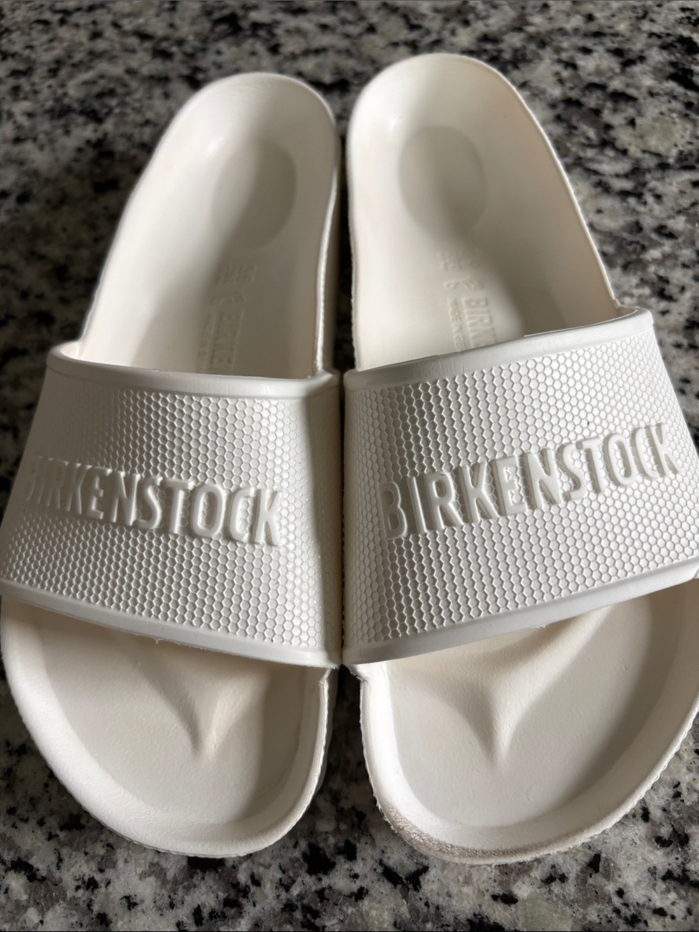 Birkenstock Woman’s White Slide Sandals with Embossed Logo